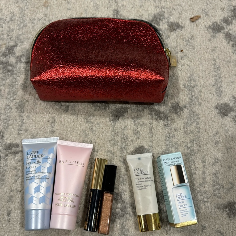 NWT Estée Lauder micro essence treatment lotion with minis and a red bag